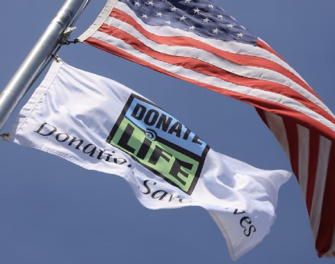 American flag waving against blue sky